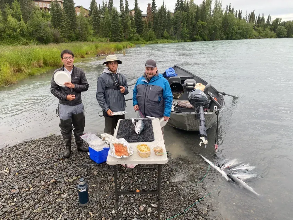 Client holding a beautiful fish caught with Cooper Landing fishing guides